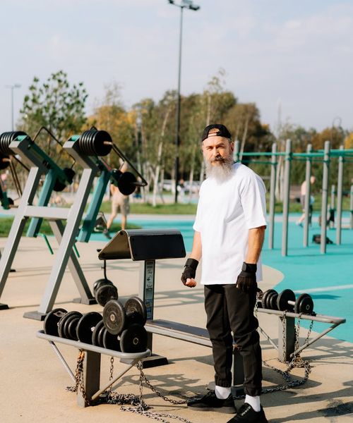 Man feeling energetic and strong outdoors in the morning.